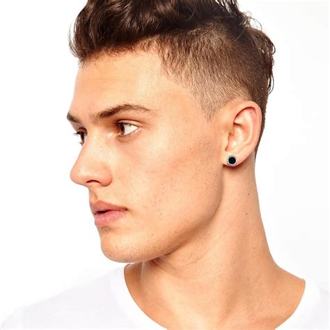 men with ear studs.